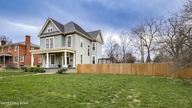 4742 Southern Pkwy, Louisville, KY 40214 - view of front of property featuring a front lawn, a shingled roof, a porch, and fence