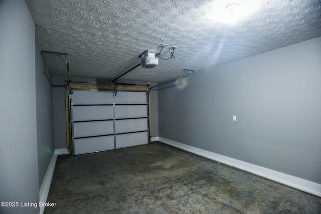 garage with a garage door opener and baseboards