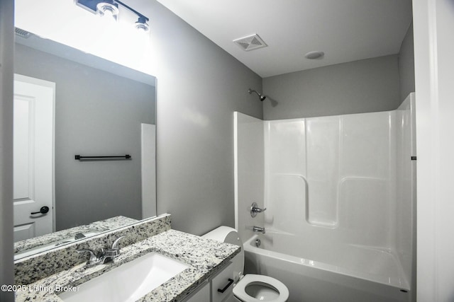 bathroom featuring vanity, toilet, visible vents, and shower / bath combination