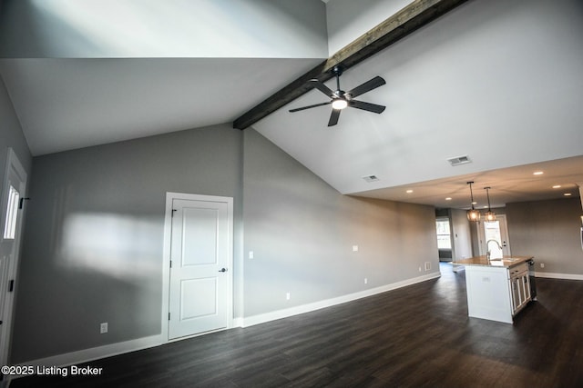 kitchen featuring beamed ceiling, visible vents, a sink, dark wood finished floors, and ceiling fan