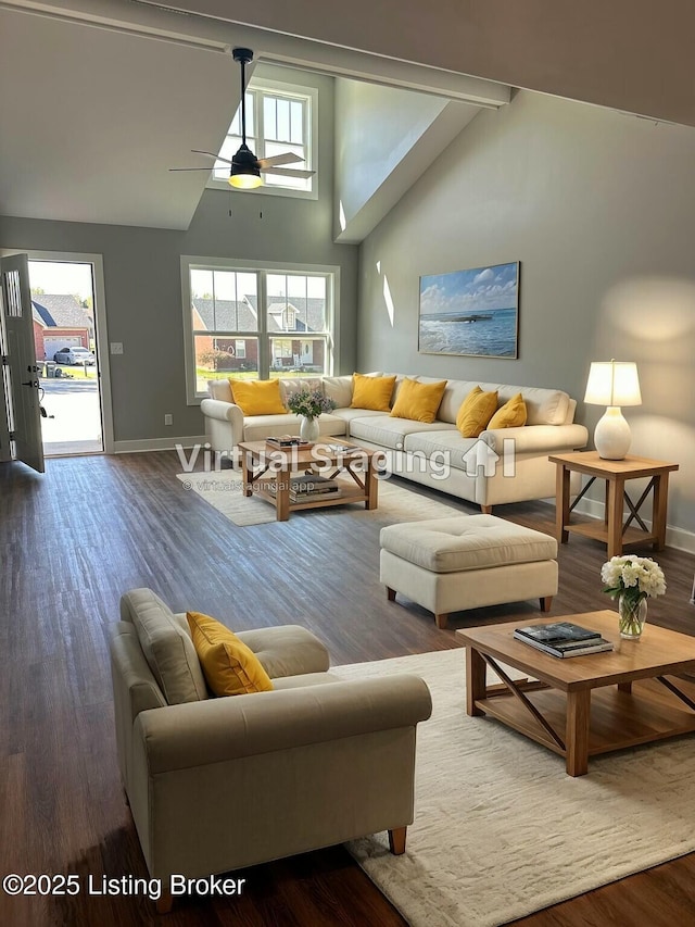 living area featuring baseboards, wood finished floors, high vaulted ceiling, and ceiling fan