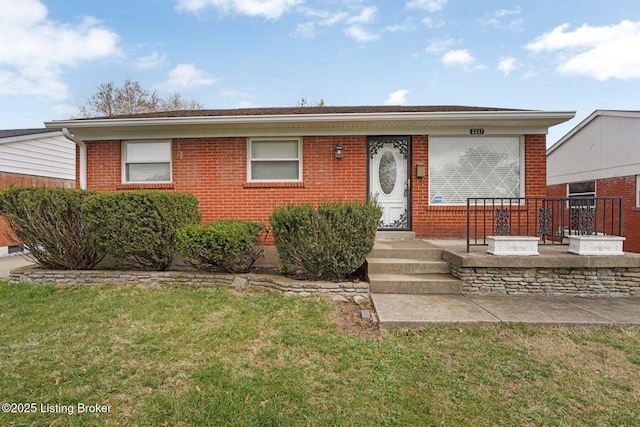 3217 Wellingmoor Ave, Louisville, KY 40218 - ranch-style house with brick siding and a front lawn