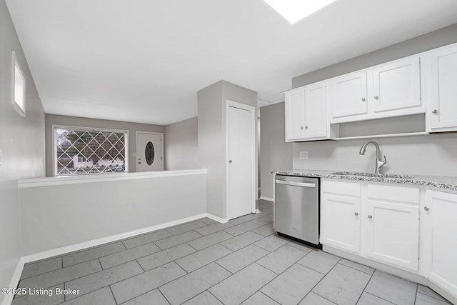 3217 Wellingmoor Ave, Louisville, KY 40218 - kitchen with a sink, open shelves, stainless steel dishwasher, white cabinets, and light stone countertops