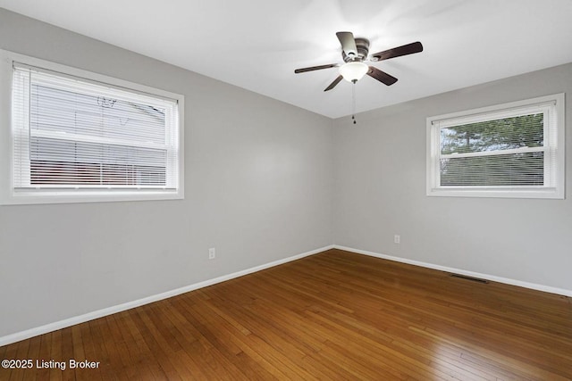3217 Wellingmoor Ave, Louisville, KY 40218 - spare room with baseboards, wood-type flooring, and ceiling fan