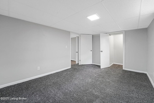 3217 Wellingmoor Ave, Louisville, KY 40218 - finished basement featuring dark colored carpet, a paneled ceiling, and baseboards