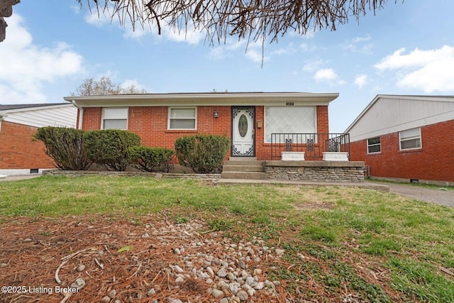 3217 Wellingmoor Ave, Louisville, KY 40218 - single story home featuring a front lawn and brick siding