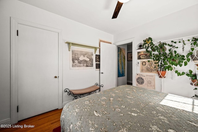 bedroom featuring wood finished floors and ceiling fan