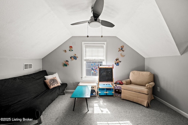 interior space featuring carpet floors, a textured ceiling, and visible vents