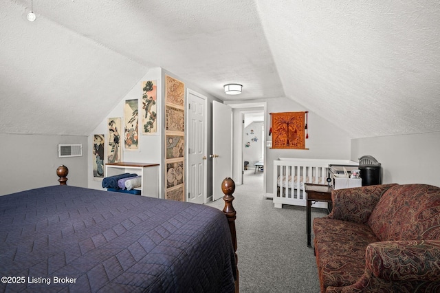 carpeted bedroom featuring visible vents, vaulted ceiling, and a textured ceiling