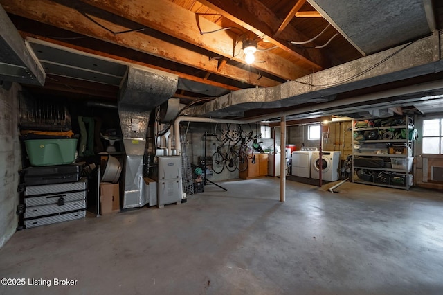 basement with separate washer and dryer and a healthy amount of sunlight