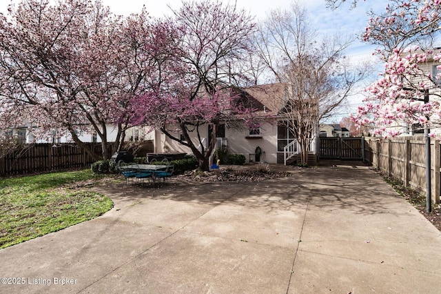 view of yard featuring outdoor dining area, a patio area, and fence private yard