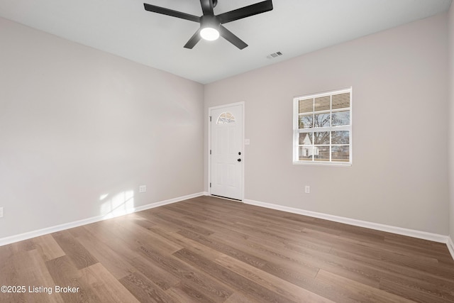 2064 Emmet Ave, Louisville, KY 40217 - empty room featuring visible vents, baseboards, ceiling fan, and wood finished floors