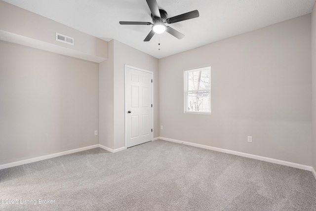 2064 Emmet Ave, Louisville, KY 40217 - carpeted empty room featuring visible vents, baseboards, and ceiling fan