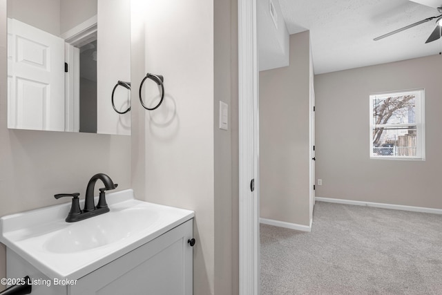 2064 Emmet Ave, Louisville, KY 40217 - bathroom with baseboards, vanity, and ceiling fan