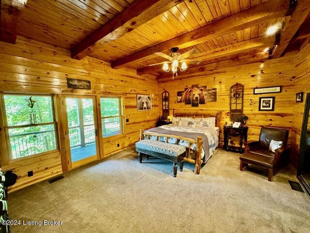 carpeted bedroom with visible vents, wooden ceiling, wooden walls, beam ceiling, and access to exterior