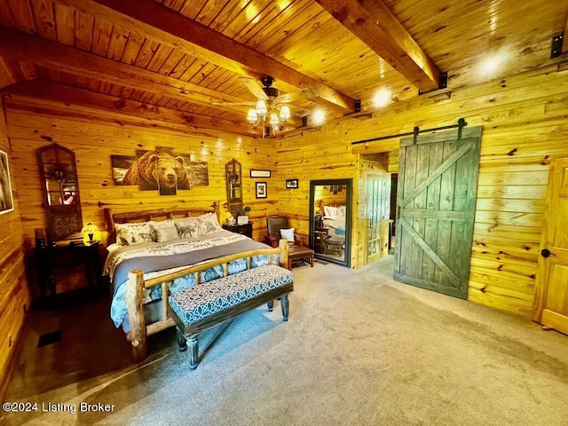 bedroom with a notable chandelier, wood walls, a barn door, beamed ceiling, and wood ceiling