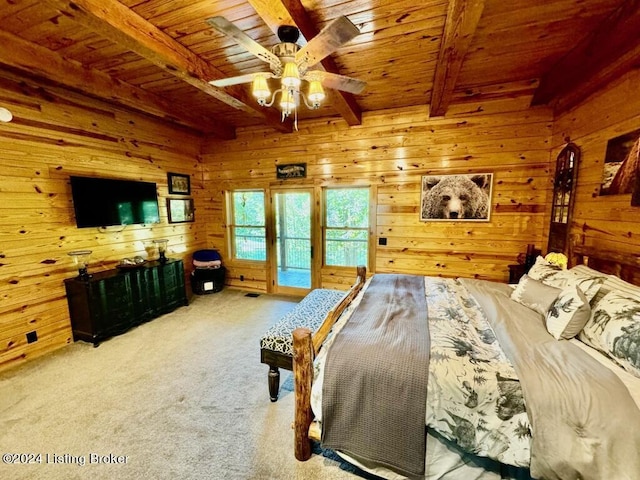 carpeted bedroom featuring access to outside, a ceiling fan, wood ceiling, wood walls, and beam ceiling