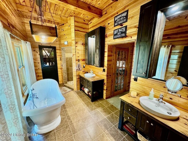 full bath featuring wooden ceiling, a sink, a soaking tub, beamed ceiling, and wood walls