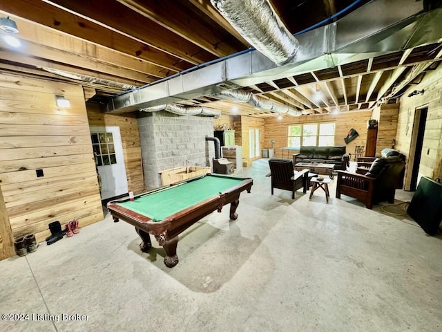 recreation room featuring wood walls, pool table, and concrete floors