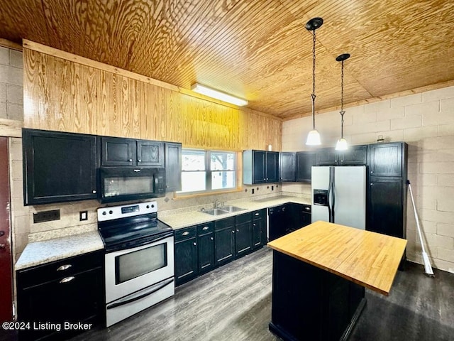 kitchen with butcher block countertops, appliances with stainless steel finishes, wood finished floors, and wood ceiling