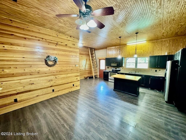 kitchen with a center island, a sink, light countertops, black appliances, and dark wood-type flooring