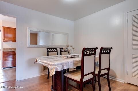 3307 Leith Ln Apt 3, Louisville, KY 40218 - dining space featuring baseboards and wood finished floors