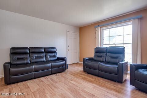 3307 Leith Ln Apt 3, Louisville, KY 40218 - living area with baseboards and light wood-style flooring