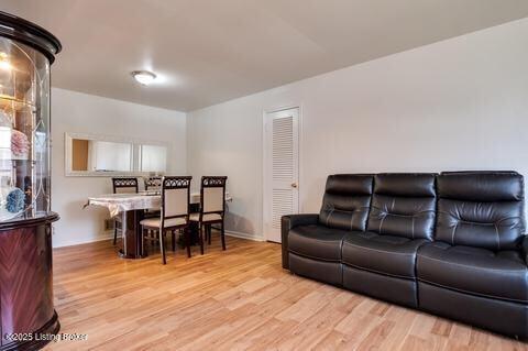 3307 Leith Ln Apt 3, Louisville, KY 40218 - living area featuring baseboards and light wood-type flooring