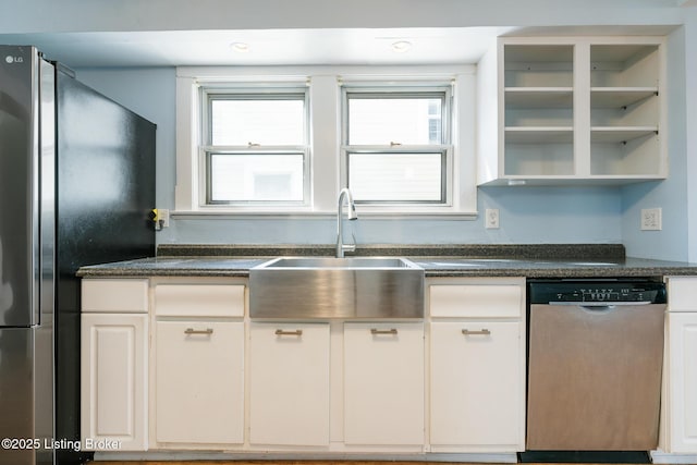 628 Harrison Ave, Louisville, KY 40217 - kitchen with dishwasher, dark countertops, a sink, open shelves, and freestanding refrigerator