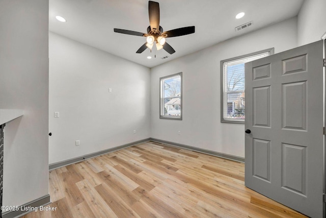 interior space featuring recessed lighting, baseboards, light wood-style floors, visible vents, and a ceiling fan