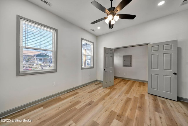unfurnished bedroom with baseboards, visible vents, recessed lighting, and light wood finished floors