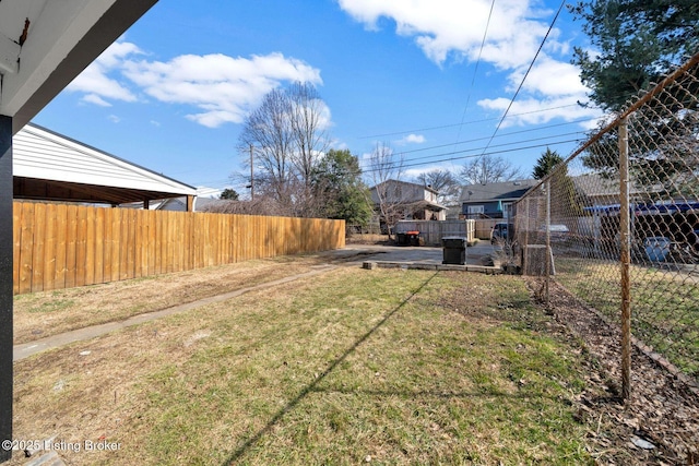 view of yard with a fenced backyard