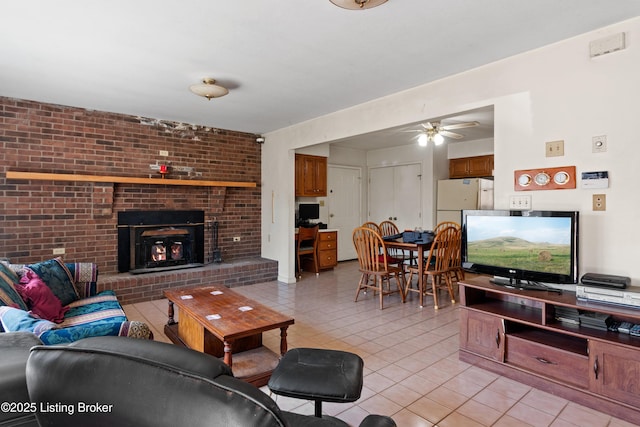 1147 Poplar Grove Rd, Buffalo, KY 42716 - living area featuring light tile patterned floors, a ceiling fan, and a brick fireplace