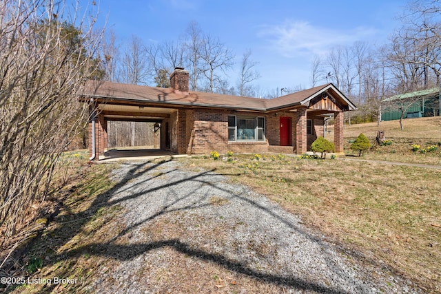 1147 Poplar Grove Rd, Buffalo, KY 42716 - ranch-style house featuring an attached carport, gravel driveway, brick siding, and a chimney