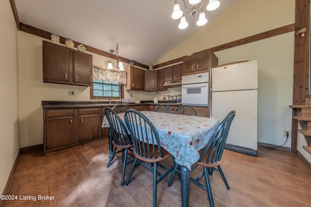 110 Nathan Rd, Falls Of Rough, KY 40119 - dining area featuring baseboards, lofted ceiling, wood finished floors, and an inviting chandelier