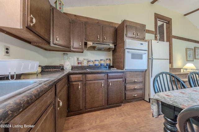 110 Nathan Rd, Falls Of Rough, KY 40119 - kitchen featuring under cabinet range hood, lofted ceiling, dark countertops, and white appliances