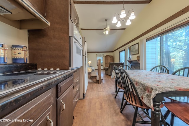 110 Nathan Rd, Falls Of Rough, KY 40119 - dining area featuring ceiling fan with notable chandelier, vaulted ceiling, and light wood-type flooring