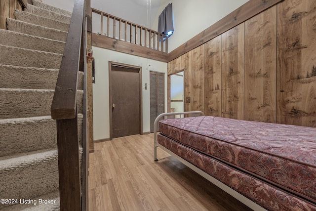 110 Nathan Rd, Falls Of Rough, KY 40119 - bedroom featuring a high ceiling, wood finished floors, and two closets