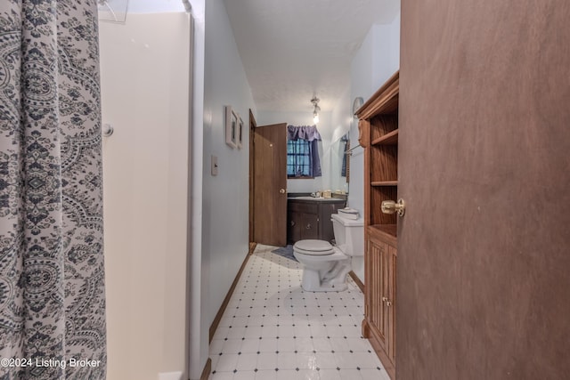 110 Nathan Rd, Falls Of Rough, KY 40119 - full bath with vanity, toilet, baseboards, tile patterned floors, and walk in shower