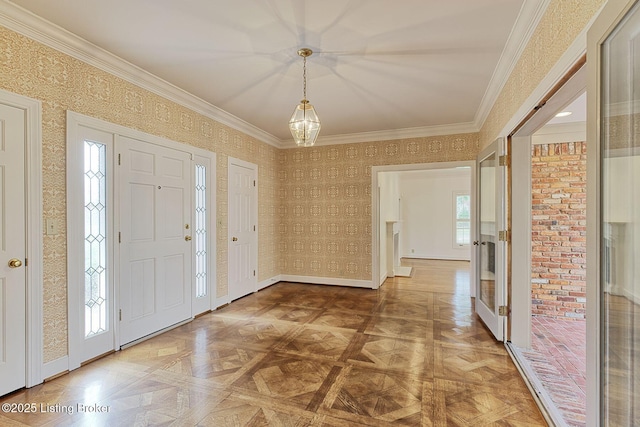 foyer entrance with a healthy amount of sunlight, baseboards, ornamental molding, and french doors