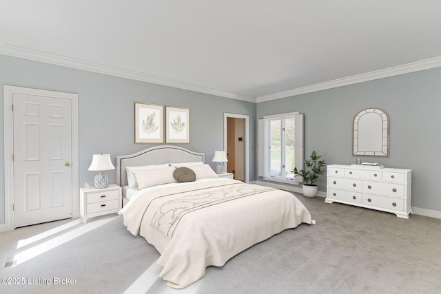 carpeted bedroom with baseboards and crown molding