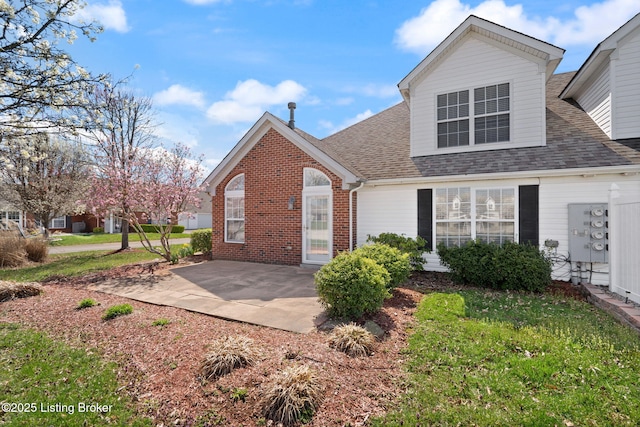 135C Michelle Dr, Shepherdsville, KY 40165 - view of front of property with brick siding, a patio, and a shingled roof