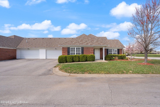 135C Michelle Dr, Shepherdsville, KY 40165 - ranch-style house with brick siding, an attached garage, a front lawn, and aphalt driveway