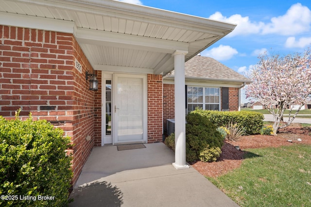 135C Michelle Dr, Shepherdsville, KY 40165 - property entrance featuring brick siding, a shingled roof, and a porch