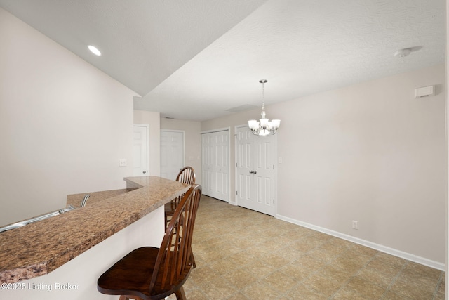 135C Michelle Dr, Shepherdsville, KY 40165 - dining area with recessed lighting, baseboards, a notable chandelier, and light floors