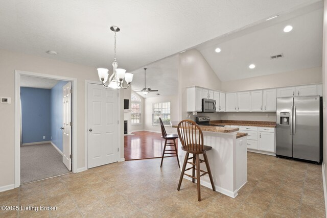 135C Michelle Dr, Shepherdsville, KY 40165 - kitchen with white cabinets, stainless steel appliances, baseboards, and visible vents