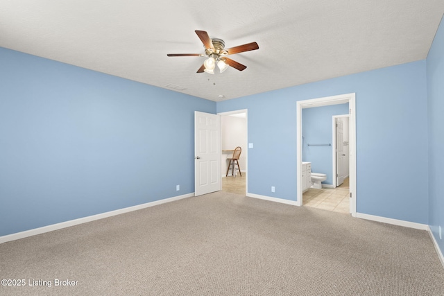 135C Michelle Dr, Shepherdsville, KY 40165 - unfurnished bedroom with visible vents, baseboards, ensuite bathroom, ceiling fan, and light colored carpet