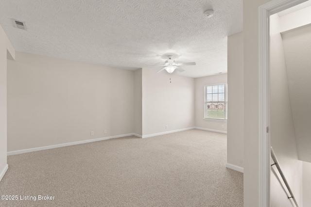 135C Michelle Dr, Shepherdsville, KY 40165 - unfurnished room featuring visible vents, baseboards, ceiling fan, light colored carpet, and a textured ceiling