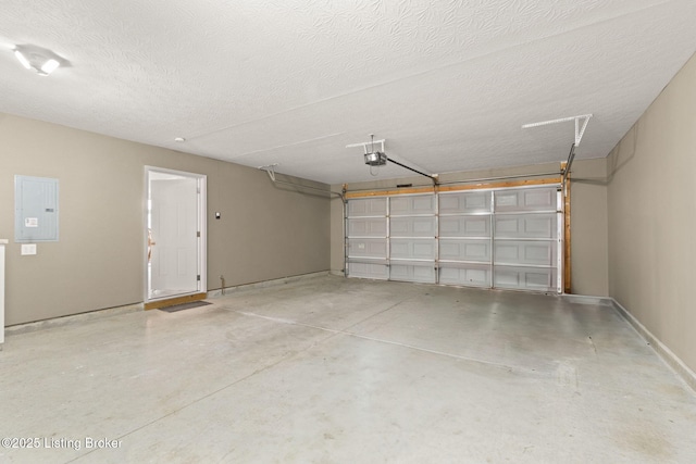 135C Michelle Dr, Shepherdsville, KY 40165 - garage featuring baseboards, a garage door opener, and electric panel