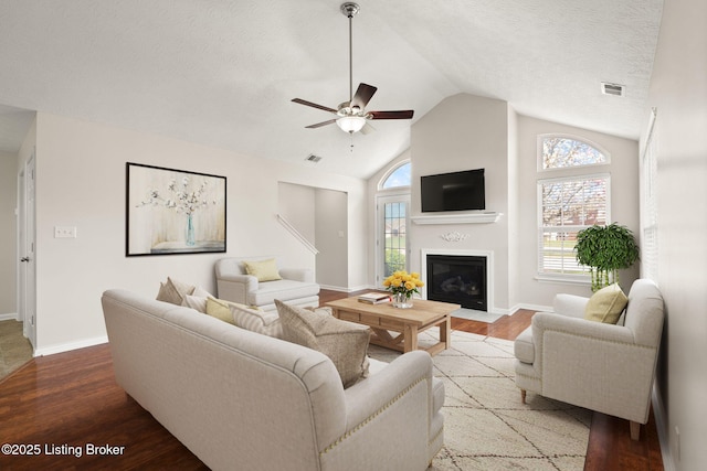 135C Michelle Dr, Shepherdsville, KY 40165 - living room with a ceiling fan, visible vents, a fireplace with flush hearth, wood finished floors, and baseboards